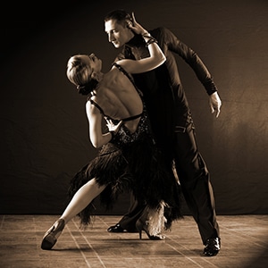 dancers in ballroom isolated on black background Tango!